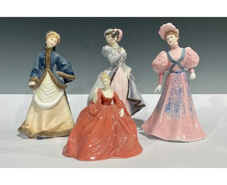 A Royal Worcester figure, Masquerade, 20cm, printed mark in black; another, Winter's Morn; a Coalport figure, Eugenie, 21cm; 