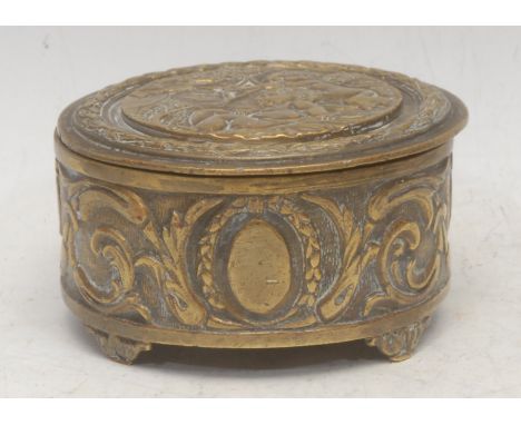 A 19th century Belgian brass trinket box, the hinged cover cast in relief with cupid at play with a putto within a laurel bor