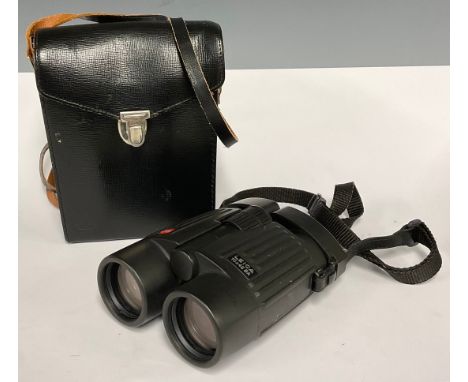 A pair of Leica folding binoculars, 10 x 42 BA, with lens caps and neck cord, Leitz Wetzlar carry case