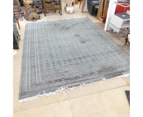A large green-ground Tekke carpet. 368x280cm.