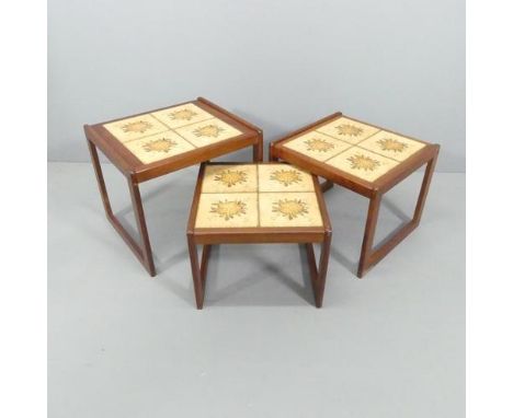 ENGLENDERA- a mid-century Danish teak nest of three tile-top occasional tables, with maker's label. Largest 54x47x47cm. 