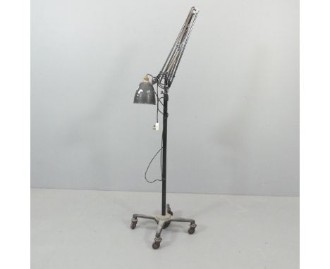 HERBERT TERRY - A mid-century floor-standing anglepoise lamp on wheeled base. With maker's mark. 