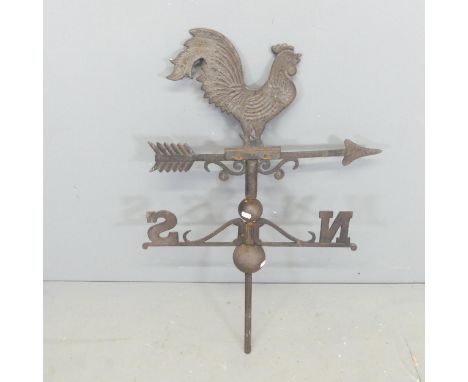 A vintage cast iron weather vane, surmounted by a cockerel. Height 90cm. 