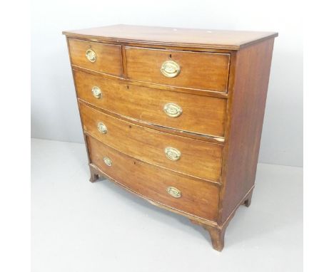 A Georgian mahogany bow-front chest of two short and three long drawers, with brass pulls inscribed "sacred to Nelson". 103x1