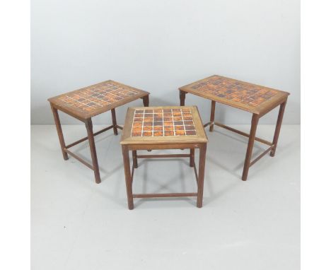 A mid-century teak nest of three tile-top occasional tables. Largest 58x47x41cm. 