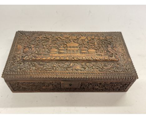 A profusely carved Anglo Indian Sandlewood box together with a Highly carved Chinese tea caddy/trinket box.