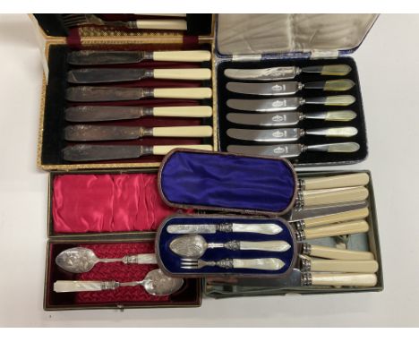 A cased George Unite hallmarked silver and mother of Pearl christening set together with 4 cased cutlery sets.