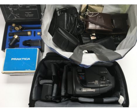 A collection of camera ps and associated equipment.