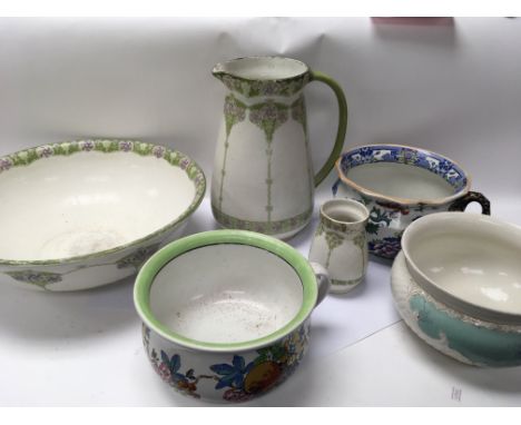 Three chamber pots, one large basin, a large jug and a smaller pot.