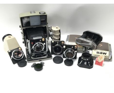 A Linhof Technika 70 medium format camera with various lenses and accessories. The lenses are all Schneider Kreuznach and con