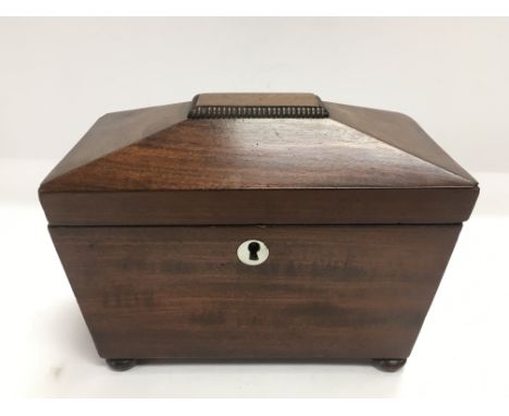 A mahogany tea caddy, approx 20cm x 12cm x 15cm.