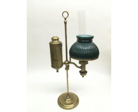 A brass student's lamp.