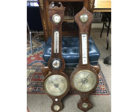 A mercury filled wall barometer and one other inlaid mahogany example (2).