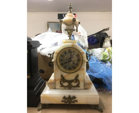 An 8 day onyx mantle clock with giltwork floral swag decoration, approx height 48cm.