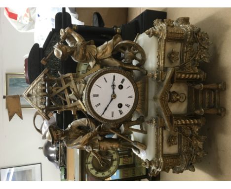An 8 day heavy gilt and onyx figural mantle clock, approx height 42cm. Comes supplied with pendulum and key.