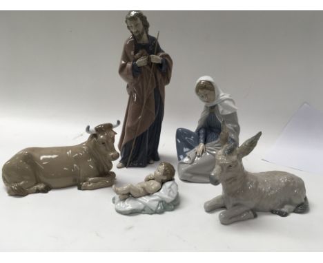 Five Nao nativity scene figures.
