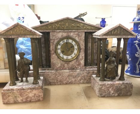 An 8 day marble mantle clock with garnitures, the clock with decorative frieze depicting Neo Classical warrior figures and Co