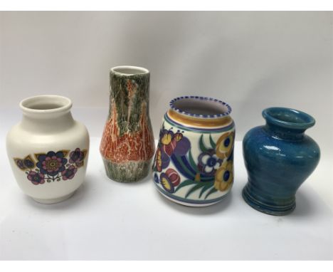 A Poole pottery vase, two Sylvac vases and one other.