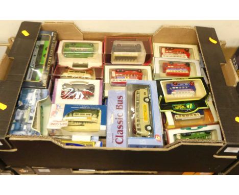 Two trays containing a quantity of various diecast and plastic public transport buses and trams to include Lledo Days Gone, a