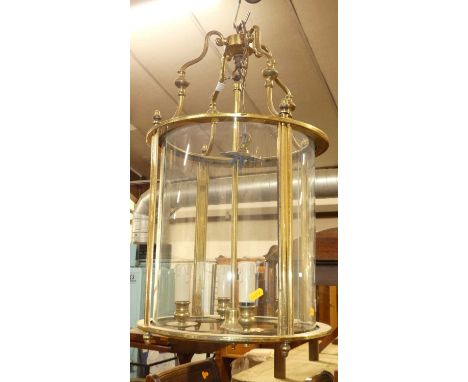 A lacquered brass and glass cylindrical four light ceiling pendant, height 63cm