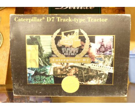 A 1:25 scale diecast model of a Caterpillar D7 tractor by NZG, model No.386