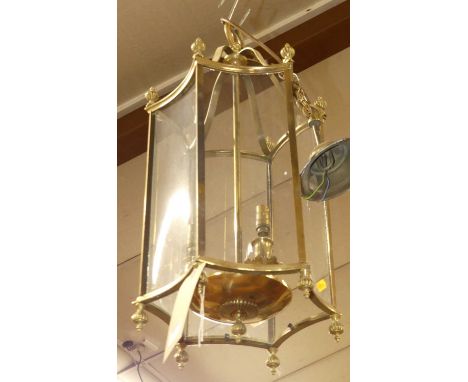 A lacquered brass and glazed hexagonal three-light ceiling pendant, height 55cm