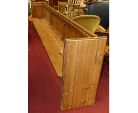 A Victorian pine pew of good size, width 306cm