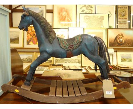 A reproduction child's painted wooden rocking horse, w.83cm