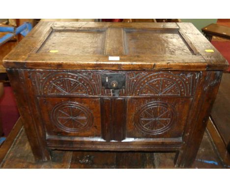 An antique joined oak two-panelled coffer of small proportions with later carving, width 68cm