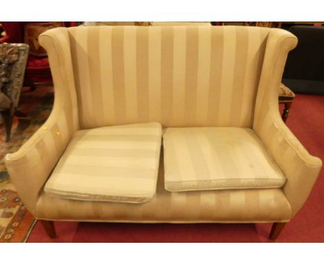 A late 19th century wing settee, upholstered in a striped cotton, width 142cm