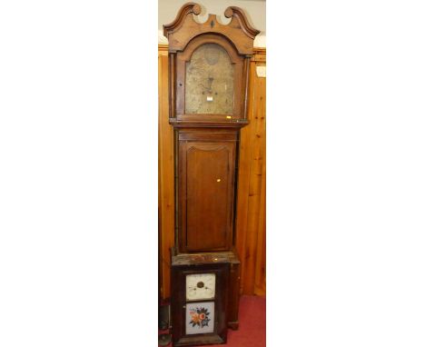 An early 19th century oak longcase clock, having 12" painted arched dial (badly distressed), eight-day weight driven movement