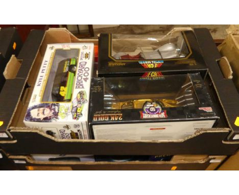 A quantity of 1/24 and 1/18 scale diecast vehicles by Racing Champions, Solido, and others