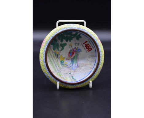 A Chinese canton enamel bowl, Qianlong four character mark and probably of the period, painted to the centre two ladies in a 