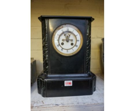 A late 19th century slate and marble mantel clock, 33cm high, with pendulum.&nbsp; 