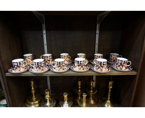 A set of twelve Royal Crown Derby Imari coffee cans and saucers. 