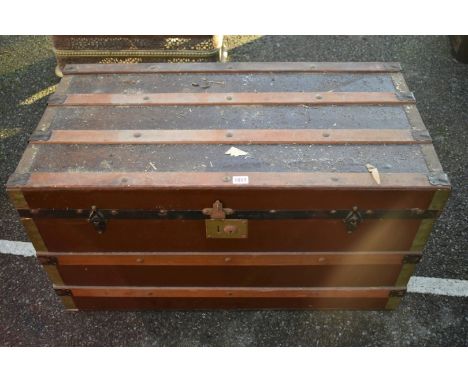 An old wooden bound canvas trunk, 92cm wide x 47cm deep. 