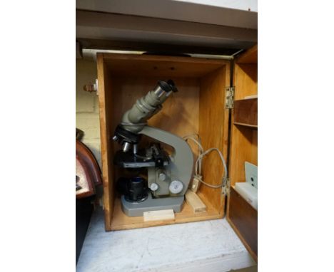 A Japanese Olympus electric binocular microscope,&nbsp;in case.&nbsp; 
