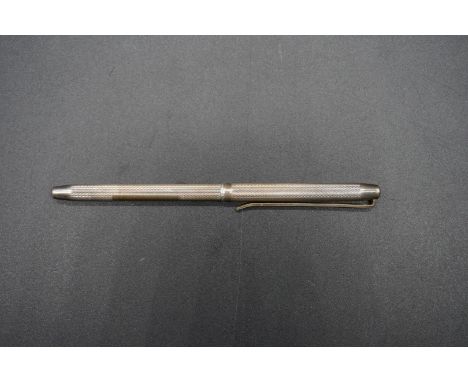 An engine turned silver propelling pencil, by&nbsp;William Manton, Birmingham 1990. 