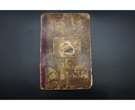 An interesting manuscript book of military badges, regimental seals, medal ribbons etc.&nbsp; 