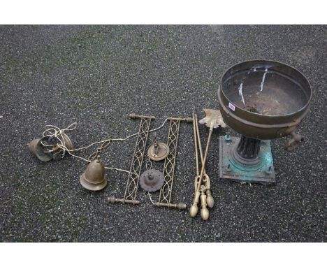 A twin-handled brass pedestal urn; together with a rise and fall ceiling light and a quantity of fire tools. 