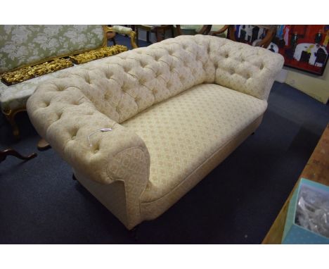 A Victorian button upholstered Chesterfield settee,&nbsp;on turned legs with ceramic casters, 177cm wide.&nbsp; 