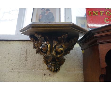 An antique gilt gesso wall bracket, moulded with acanthus leaves, 39cm wide.&nbsp; 