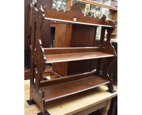 A circa 1900 mahogany three tier shelf,&nbsp;85.5cm wide.&nbsp; 