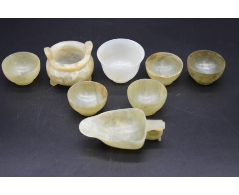 A small group of Chinese jade,&nbsp;to include a small twin handled tripod censer, 6cm wide; and an Archaistic pouring vessel