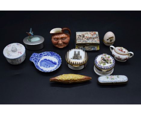 A small group of enamel boxes and small ceramic items.&nbsp; 