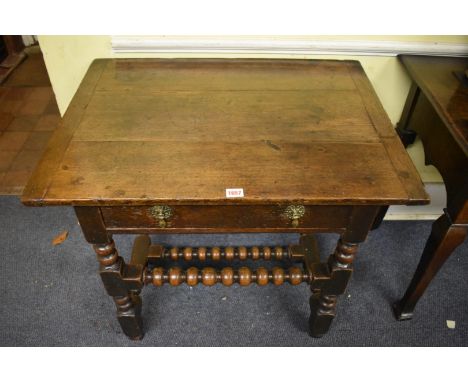 A Charles II oak single drawer side table,&nbsp;with bobbin turnings, 66cm high x 76.5cm wide. 