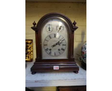 An early 20th century mahogany mantel clock, the silvered arched dial inscribed 'W R Bullen, 29 London St, Norwich', 37cm hig