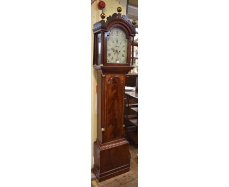 A George III mahogany eight day longcase clock, the 12in painted arched dial with thistle hands, height to top of finial 229.