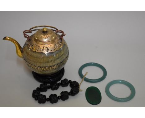 A mixed group of Chinese hardstone items, comprising: a brass mounted teapot &amp; cover, 15cm high; a Buddha's head bead bra