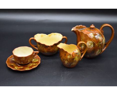 A Linthorpe pottery bachelor's teaset, possibly by Christopher Dresser, the teapot 12.5cm high. 